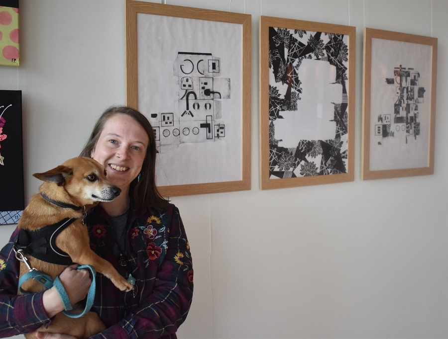 Emily Streatfield with her dog Foxy at The Apex in Bury in front of the work she produced for an exhibition called Infinite Echoes