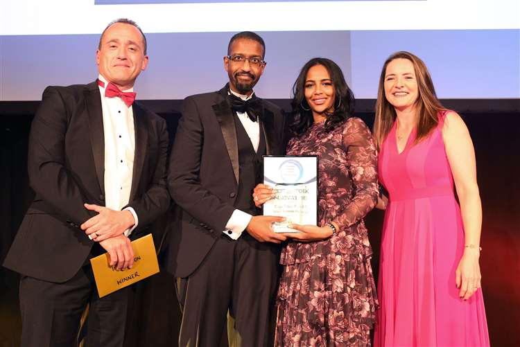 Daemmon Reeve, TREATT CEO, presents the award to Grid 2 - Net Zero and West Suffolk College. Left, event host Goldie Sayers. Picture: Richard Marsham