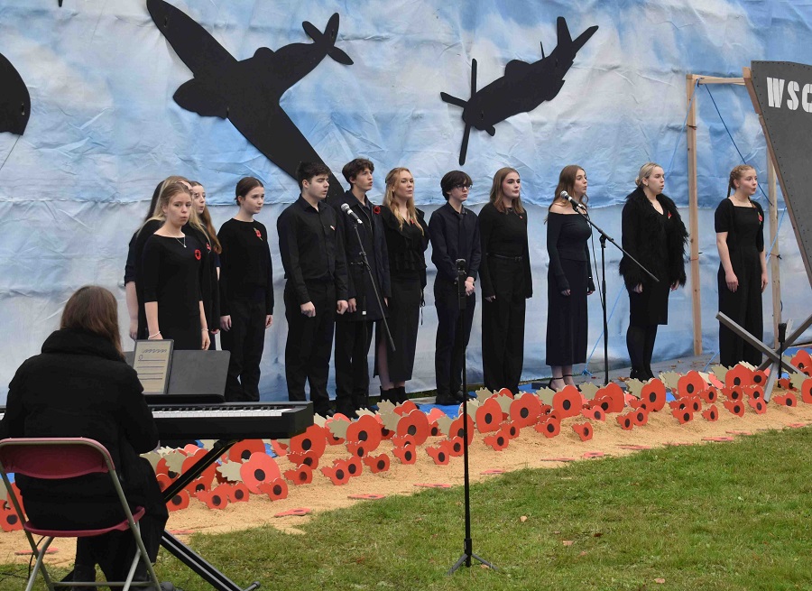 10 Performing Arts students from a group called Acado sang a tribute at this remembrance event held at the Built Environment campus at West Suff