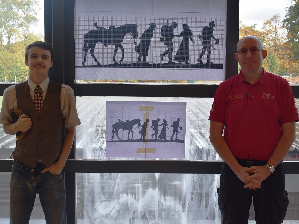 Ryan Lewis and Brian Tunbridge pictured by the design for the memorial tribute to the fallen for Remembrance 2022