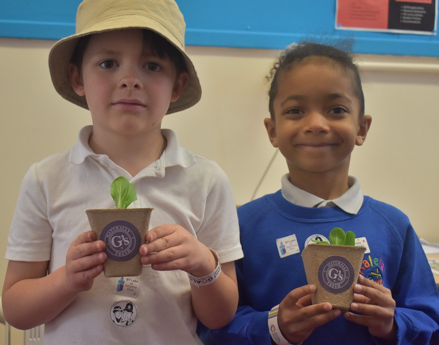 1 two younsgters from Raleigh Primary School with their iceberg lecttuce ready to take home and plant in the garden thanks to a link up with Gs Fresh
