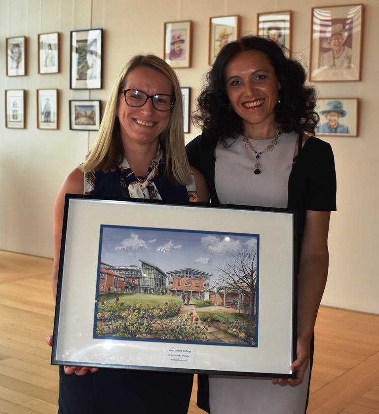 Tracy Murray and Agnieszka Procajlo at the Apex - lady with blonde straight hair and lady with curly hair surrounded by four paintings