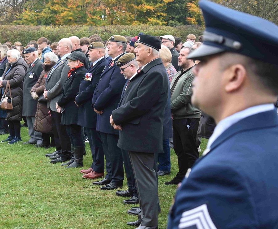 Visitors to the West Suffolk College remembrance event fall silent to honour the fallen