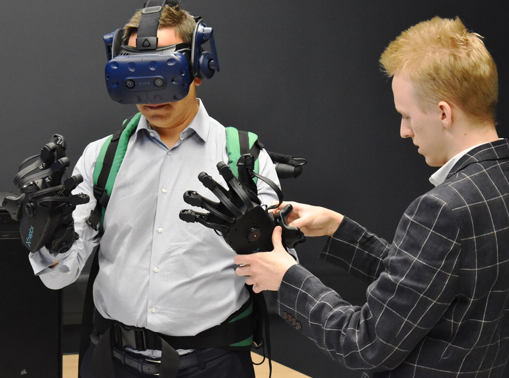 9 JAson Holt CEO of Metaverse trying out some of the equipment in the XR Lab with Jake Mills a former student West Suffolk College student wh