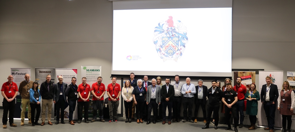 Guest speakers, organisers and college represntatives gather together for a group photograph