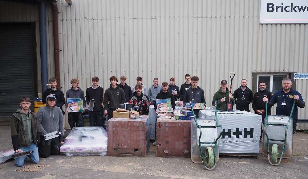 Students standing by the donation from Flagship Homes