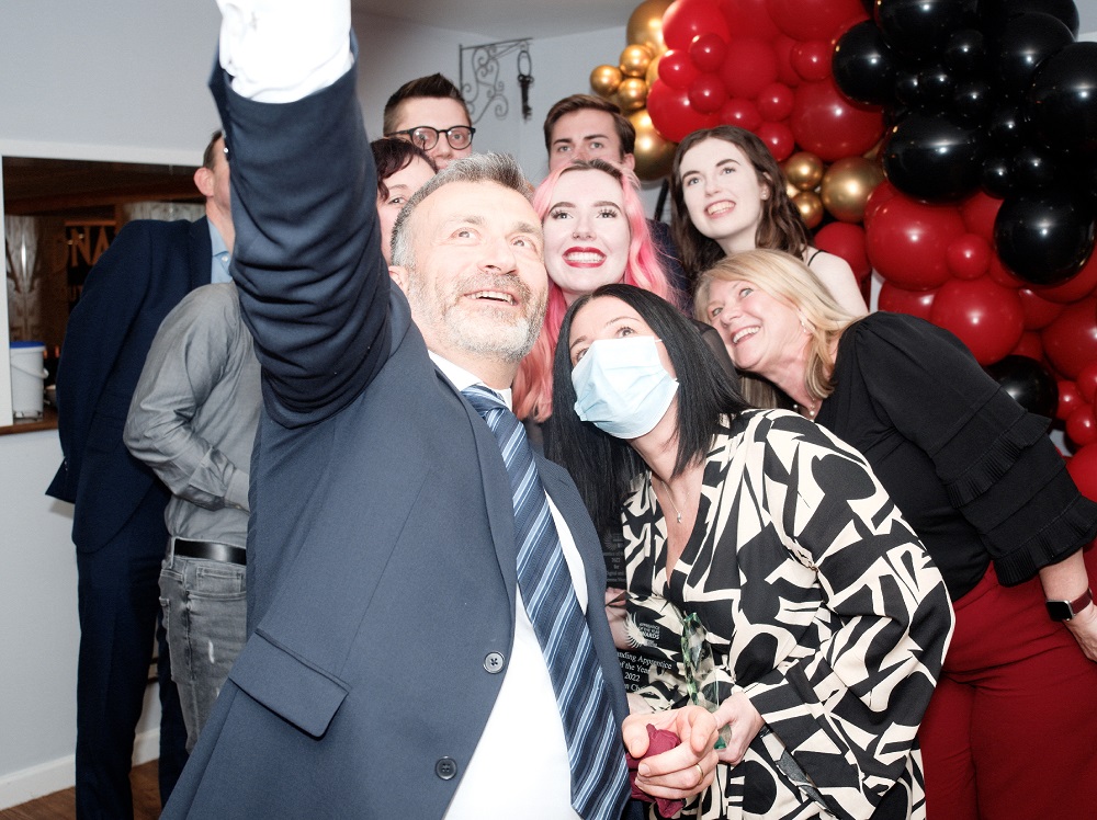 Nikos Savvas having a selfie with apprenticeship award winners