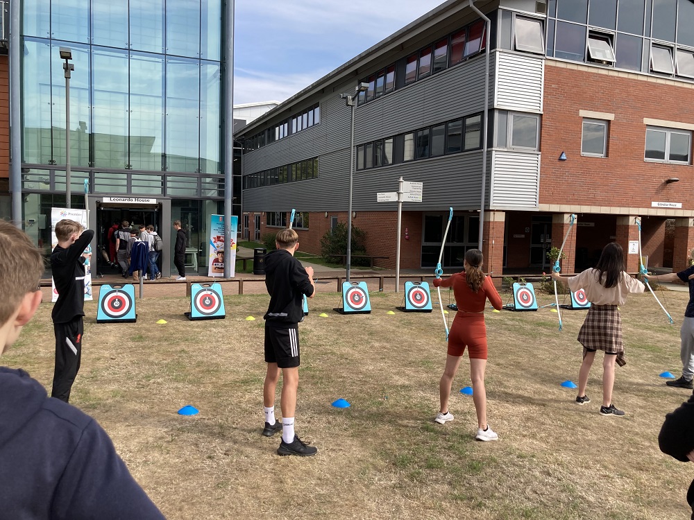 Students trying archery
