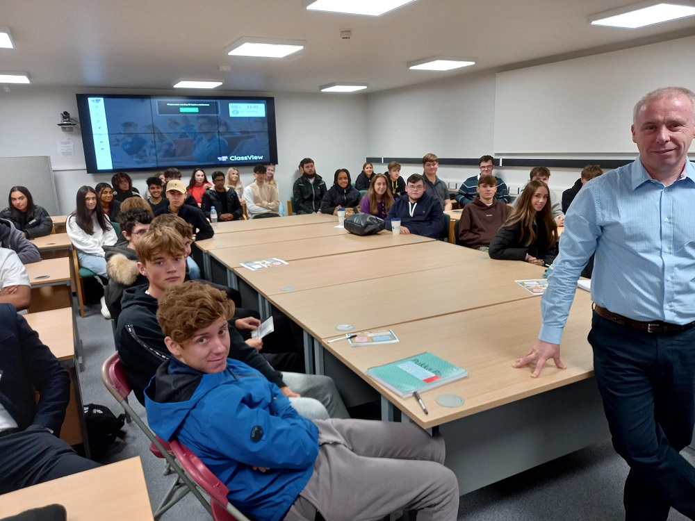 Students pictured with Amazon's head of global supply and logistics