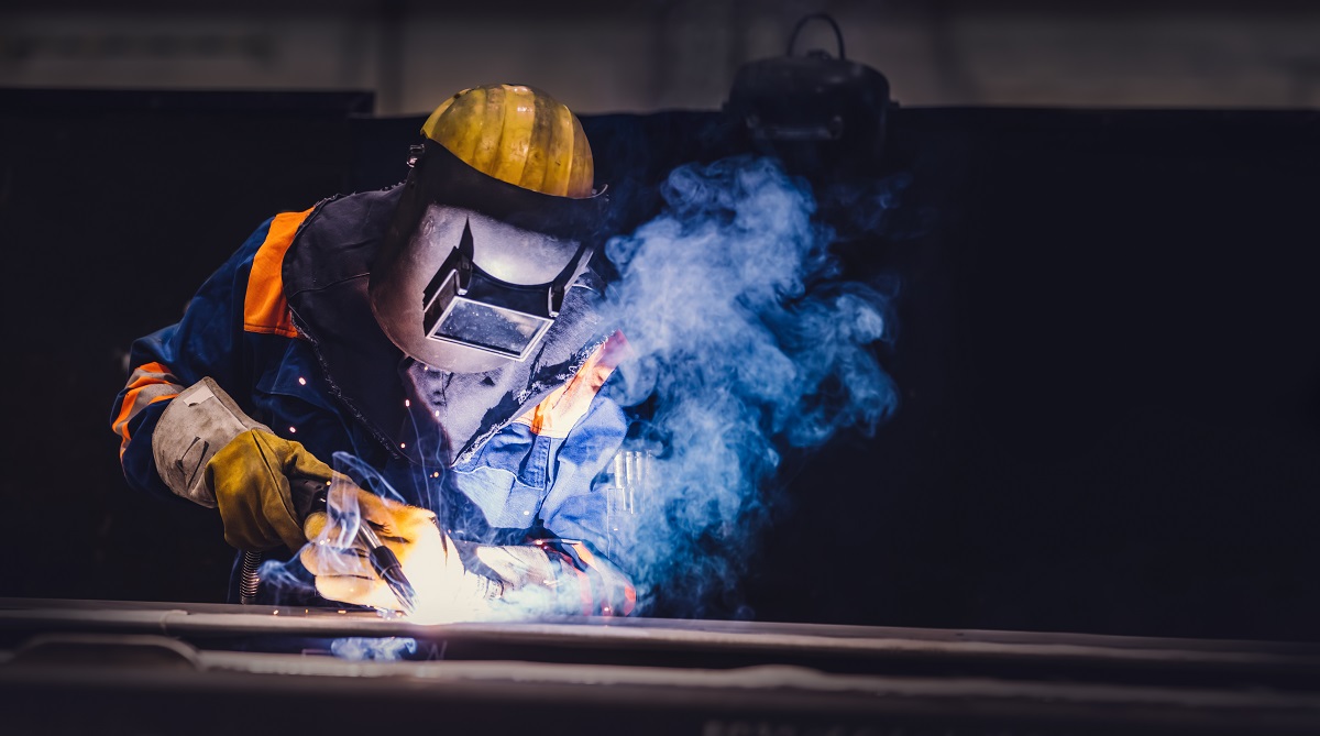 worker welding in a factory