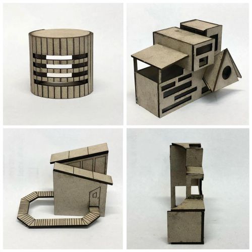 Photo of four cardboard made buildings
