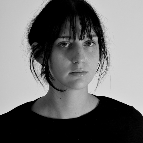 Close up of a person looking into the camera in black and white