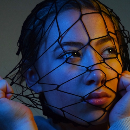 Photo of a person with a net over their head