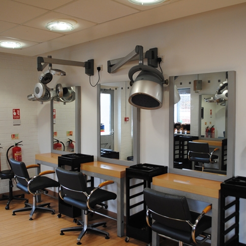 Hair stations with overhead dryers
