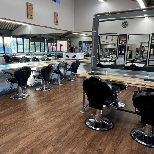 Wide photo of Salon showing seats and mirrors
